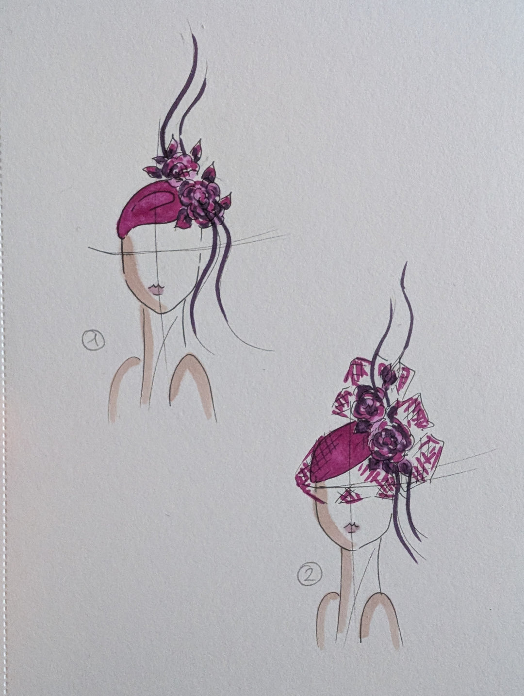 Sketch of two pink floral headpieces on a paper